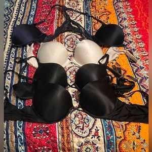 Victoria's Secret 34B Bombshell bras in blue, black, and white.